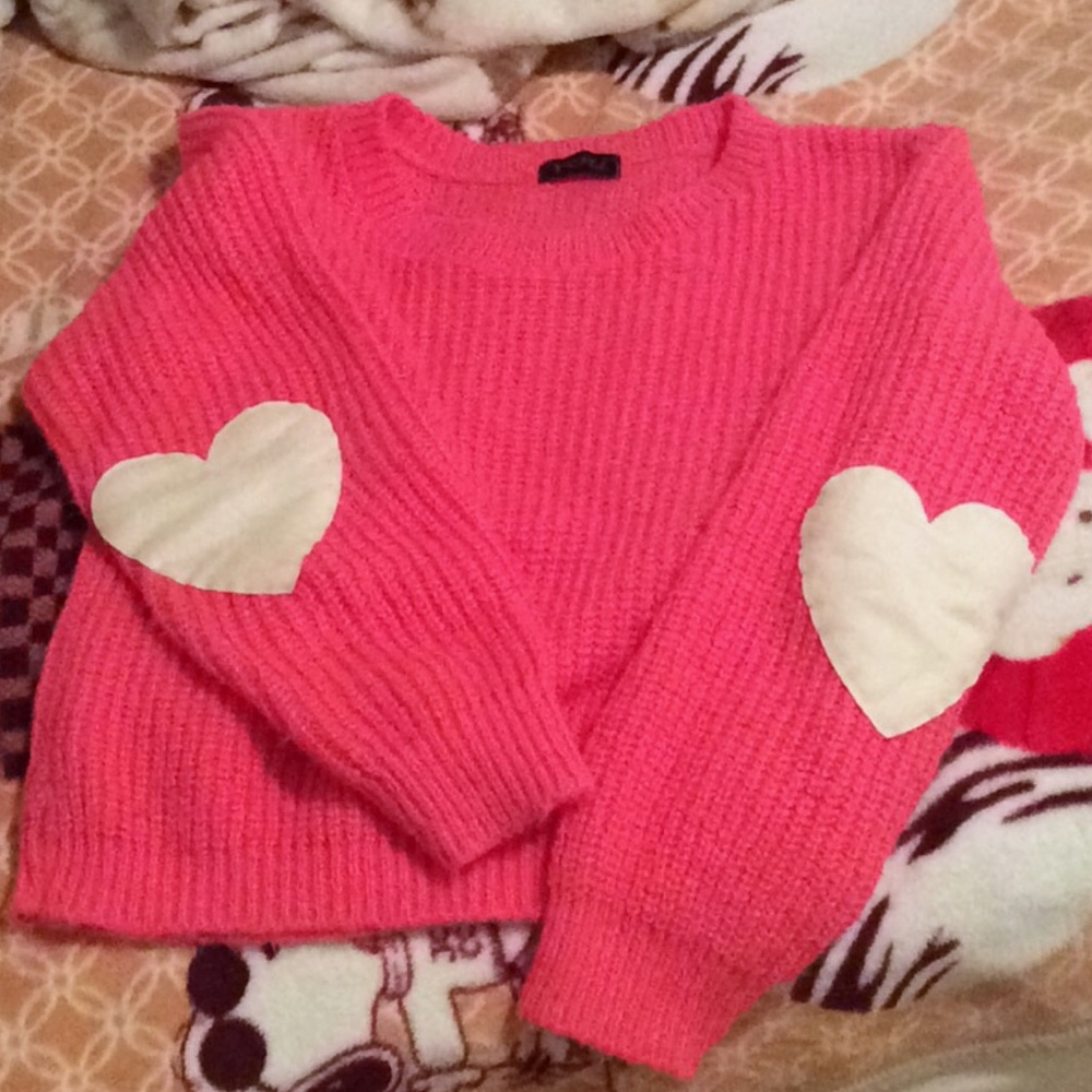 Pink pullover with heart elbow detail